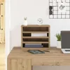 A desk organizer on a wooden desk with a laptop and a plant. Produktbild-Vorschau