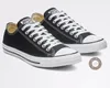 A pair of black Converse All Star sneakers with white laces and soles, displayed against a white background. Voir les images du produit