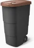 A dark gray trash can with a brown lid and wheels, shown from a slight angle against a white background. Náhled obrázku produktu