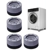 A white washing machine is shown with four gray and black anti-vibration pads for its feet. Produktbild-Vorschau