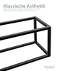 A close-up of a black metal frame, likely part of a shelf or stand, with German text overlay describing its aesthetic and stability. Produktbild-Vorschau