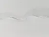 A close-up view of a white mattress cover with a zipper. Náhľad obrázku produktu