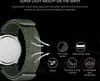 Close-up of a green watch strap with marketing text and icons highlighting features. Produktbild-Vorschau