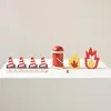 A collection of wooden toy firefighting accessories, including traffic cones, a fire bucket, and flames, arranged on a white surface against a light gray background. Produktbild-Vorschau