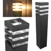 A collage of images showing a modern outdoor bollard light with a black metal frame and clear glass panels, illuminated against a wooden background and on a white background. Anteprima dell’immagine prodotto