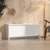 A white TV stand is shown in a room with a floor lamp and a plant. Náhľad obrázku produktu