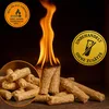 A pile of wood pellets with flames burning from one of them, with two circular marketing badges. Produktbild-Vorschau
