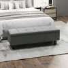 A storage bench is placed in front of a bed in a bedroom. Produktbild-Vorschau