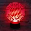 A red and white FC Bayern München logo light is displayed on a brick-like background. Anteprima dell’immagine prodotto