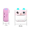 Two views of a pink toy camera with a cat-like face, shown from the side and front, with dimensions indicated. Anteprima dell’immagine prodotto