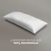 A white quilted pillow is shown on a plain gray background. Produktbild-Vorschau