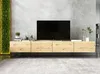 A modern media console with a television and decorative items, against a textured gray wall. Podgląd zdjęcia produktu