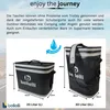 Two insulated bags, one smaller and one larger, are displayed with dimensions and branding. The background is a blurred road scene. Produktbild-Vorschau
