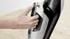 A hand is shown operating a part of a vacuum cleaner handle. Produktbild-Vorschau