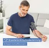 A man is using a blood pressure monitor at home. Podgląd zdjęcia produktu