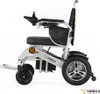 Side view of a silver and black electric wheelchair against a white background. Náhľad obrázku produktu