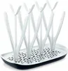 A white and black bottle drying rack with multiple prongs for drying bottles and accessories. Produktbild-Vorschau