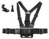 A black chest harness mount for a camera, along with two small accessories, is displayed against a white background. Anteprima dell’immagine prodotto