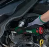 A person's gloved hand is using a cordless ratchet tool on a car engine. Podgląd zdjęcia produktu