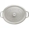 A top-down view of a white oval Staub cast iron casserole dish. Voir les images du produit