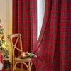 A Christmas-themed scene with plaid curtains, a chair, and a Christmas tree. Produktbild-Vorschau