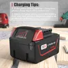 A power tool battery is shown on a wooden surface with charging tips displayed in the background. Náhled obrázku produktu