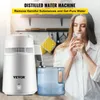 A woman drinks water next to a distilled water machine. Náhľad obrázku produktu