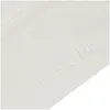 A close-up view of a white textured surface with embossed text. Produktbild-Vorschau