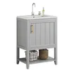 A light gray vanity cabinet with a white sink and faucet, shown against a white background. Two baskets are placed on the lower shelf. Voir les images du produit