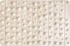 A close-up, top-down view of a textured surface with raised circular bumps arranged in a grid pattern. Náhľad obrázku produktu