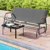 A garden bench and table are set up on a patio next to a swimming pool, with lush greenery in the background. Produktbild-Vorschau