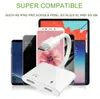 A white USB-C adapter is shown in the foreground, with several smartphones and a tablet displayed behind it. Náhled obrázku produktu