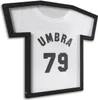 A framed t-shirt with the word UMBRA and the number 79 printed on it. Náhled obrázku produktu