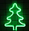 A green neon Christmas tree light against a dark grid background. Náhled obrázku produktu
