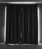A pair of closed black curtains with light shining from behind them. Produktbild-Vorschau
