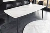 A dining room scene with a marble-patterned table and black chairs. Produktbild-Vorschau