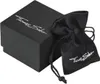 A black gift box and a black drawstring pouch, both with the 'Thomas Sabo' logo, are shown on a white background. Voir les images du produit