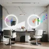 A modern salon or bathroom setting with two illuminated mirrors, chairs, and decorative elements. Anteprima dell’immagine prodotto