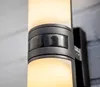A close-up view of a modern outdoor wall light fixture. Anteprima dell’immagine prodotto