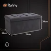 A dark background with a gray storage bench and dimensions indicated. Voir les images du produit