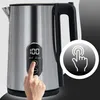 A hand is shown pressing a button on a stainless steel electric kettle with a digital display. Produktbild-Vorschau