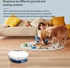 A child and a dog are playing on the floor with toys, while a robot vacuum cleaner is in the foreground. Produktbild-Vorschau