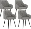 Four dark gray dining chairs with diamond-stitched upholstery and black metal legs are arranged in a grid formation against a white background.