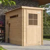 A wooden garden shed with a window and door, situated on a paved patio next to a brick wall. Produktbild-Vorschau