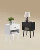 Two nightstands, one white and one black, are displayed against a neutral background. Náhled obrázku produktu