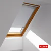 Interior view of a VELUX skylight with a partially deployed roller blind. Produktbild-Vorschau