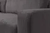 A close-up view of the armrest and seat of a gray corduroy sofa. Produktbild-Vorschau
