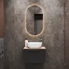 A modern bathroom vanity with a sink and mirror. Produktbild-Vorschau