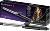 A Remington Pro Spiral Curl hair curler is shown in front of its packaging, which features a model with styled hair. Náhled obrázku produktu