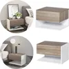 Collage of a modern floating nightstand with a drawer and open shelf, shown in different bedroom settings and as a standalone product. Produktbild-Vorschau